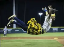  ?? STEPHEN B. MORTON FOR THE AJC ?? The Savannah Bananas’ Dancing First Base Coach Maceo performs during a game with the Holly Springs Salamander­s in July of 2022 in Savannah.