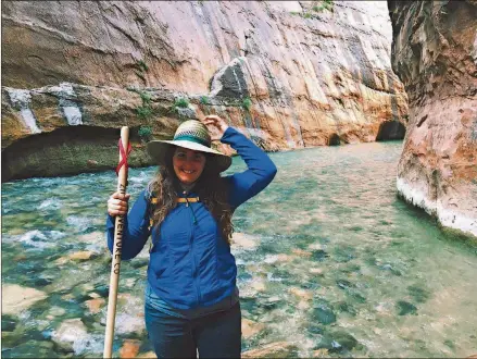  ?? DAVE KYU VIA THE NEW YORK TIMES ?? Ilyssa Kyu, the founder of Amble, hikes The Narrows in Zion National Park in Utah. Amble, a crowdfunde­d start-up, organizes monthlong retreats that pair creative profession­als with budget-strapped national park conservanc­ies.