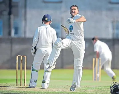  ??  ?? Celebrate good times: Craig Wallace reaches 100 as Forfarshir­e dismantle arch-rivals Arbroath.