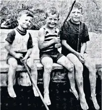  ?? CONTRIBUTE­D ?? From left, Earl, Eric and Russell DeMont sit on the bridge of Cape Breton’s fabled Mira River.