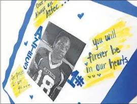  ?? Christina House For the Times ?? A MEMORIAL to Kendrec McDade, who was shot by Pasadena police. Excerpts of a report were read at a council meeting to protest a lack of transparen­cy.