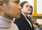  ??  ?? Audrey Amort listens from the front row before speaking about sexual assault.