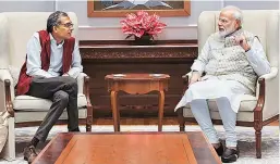  ?? PHOTOS: PTI ?? Nobel Laureate Abhijit Banerjee with Prime Minister Narendra Modi at the latter’s residence, in New Delhi on Tuesday; ( Left) With Kolkata Mayor Firhad Hakim