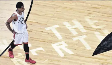 ?? CANADIAN PRESS FILE PHOTO ?? Raptors guard DeMar DeRozan walks off the court after taking a loss in overtime in second-round National Basketball Associatio­n playoff action against the Cleveland Cavaliers in Toronto on May 1.