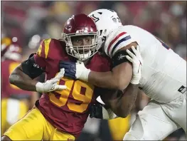  ?? MARCIO JOSE SANCHEZ — THE ASSOCIATED PRESS FILE ?? Southern California linebacker Drake Jackson (99) tries to pass-rush around the block from Arizona offensive lineman Jordan Morgan during the second half of an NCAA college football game in Los Angeles.