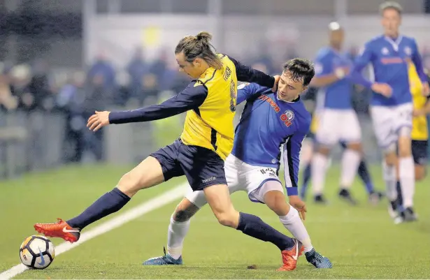  ?? Steven Paston ?? ●●Slough Town’s Matthew Lench is closed down by Dale midfielder Ollie Rathbone during Monday’s second round clash at Arbour Park