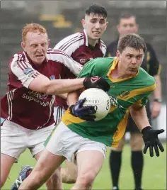  ??  ?? Brian O’Neill is challenged by Seán Stafford of St. Martin’s.