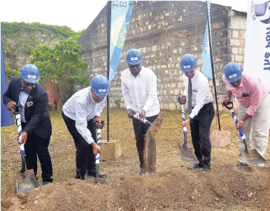  ?? PHOTO BY OKOYE HENRY ?? Ground being broken for the Hampden Wharf Developmen­t in Falmouth, Trelawny. Getting the job done (from left) are: Mayor of Falmouth Collen Gager; Gordon Shirley, president and CEO of the Port Authority of Jamaica; Edmund Bartlett, tourism minister; Dr...