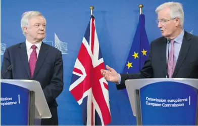  ?? VIRGINIA MAYO / THE ASSOCIATED PRESS ?? British Secretary of State David Davis, left, and EU chief Brexit negotiator Michel Barnier make statements Monday at EU headquarte­rs in Brussels as they begin formal talks on the U.K. leaving the European Union.