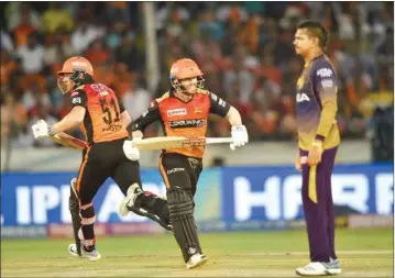  ?? PIC/PTI ?? Sunrisers Hyderabad (SRH) batsmen Jonny Bairstow and David Warner run to collect singles while bowler Sunil Narine looks on during the IPL T20 cricket match between SRH and Kolkata Knight Riders at Rajiv Gandhi Internatio­nal Cricket Stadium in Hyderabad,sunday