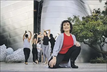  ?? Gina Ferazzi Los Angeles Times ?? JANET ROSTON, choreograp­her, and her dance company rehearsing Moves After Dark outside Disney Hall.