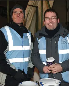  ??  ?? Dave Kavanagh and Fr Barry Matthews collecting on behalf of the Drogheda Homeless Aid.