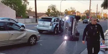  ?? REUTERS PIC ?? A self-driven Volvo vehicle owned and operated by Uber Technologi­es Inc is flipped on its side after a collision in Tempe, Arizona, on Friday.