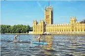  ??  ?? MAKING A STAND Paddle boarders in London
