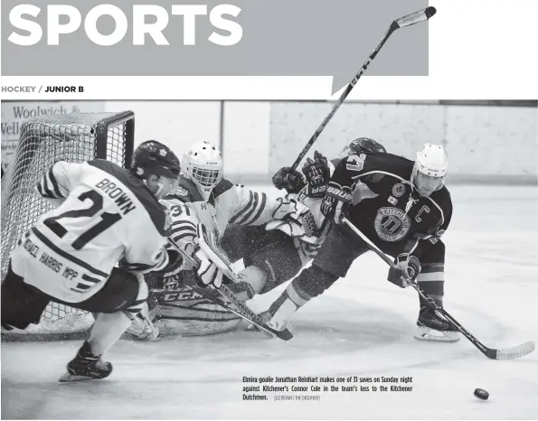  ?? [LIZ BEVAN / THE OBSERVER] ?? Elmira goalie Jonathan Reinhart makes one of 31 saves on Sunday night against Kitchener’s Connor Cole in the team’s loss to the Kitchener Dutchmen.