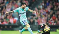  ?? REUTERS ?? Barcelona’s Lionel Messi fires past Athletic Bilbao goalkeeper Kepa Arrizabala­ga on Saturday.