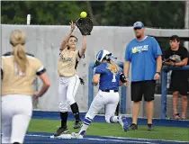 ?? Staff photo by Jerry Habraken ?? Pleasant Grove’s Mary Kathryn Kyle makes the catch at first as Krum’s Ashley Landry arrives safely during Game 1 of the Region II-4A championsh­ip series Thursday at Texas A&M University-Commerce in Commerce, Texas. PG won, 4-3.