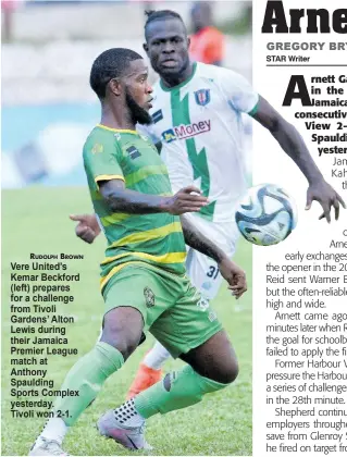  ?? ?? RUDOLPH BROWN Vere United’s Kemar Beckford (left) prepares for a challenge from Tivoli Gardens’ Alton Lewis during their Jamaica Premier League match at Anthony Spaulding Sports Complex yesterday. Tivoli won 2-1.