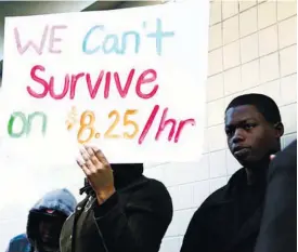  ?? (AP FOTO) ?? MORE STUDY NEEDED. Protesters demonstrat­e outside a McDonald’s restaurant in Oakland, California. A federal court on Tuesday blocked the implementa­tion of a rule imposed by President Barack Obama’s administra­tion that would have made an estimated four...