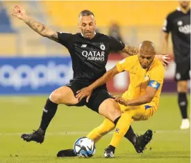  ?? ?? Al Gharafa’s Yacine Brahimi (right) and Al Sadd’s Guilherme Torres battle for the ball during the Expo Stars League at the Thani Bin Jassim Stadium yesterday.