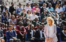  ?? Dirk Heinrich/Associated Press ?? First lady Jill Biden greets students while on a visit to Namibia. Biden told the young people that the democracy their parents and grandparen­ts fought for is now theirs to protect.