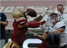  ?? STUART CAHILL / HERALD STAFF FILE ?? ‘AMAZING FEELING’: Boston College strong safety Jahmin Muse returned an intercepti­on for a touchdown in the Eagles’ season opener on Saturday against Colgate. Above, Muse blankets Georgia Tech’s Josh Blancato last season at Alumni Stadium. Below. BC’s Trae Barry hurdles over Colgate’s Keshaun Dancy on his way to the end zone.