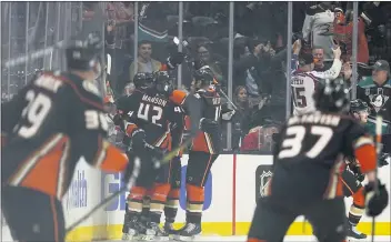  ?? ASHLEY LANDIS — THE ASSOCIATED PRESS ?? Ducks celebrate after Cam Fowler scored off Ryan Getzlaf’s assist against the Capitals. It was Getzlaf’s 1,000th career point.