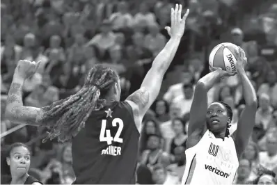  ?? Associated Press ?? ■ Team Candace Parker's Chelsea Gray, right, lines up a shot against Team Delle Donne's Brittney Griner, left, in the first half of the WNBA All-Star basketball game Saturday in Minneapoli­s.