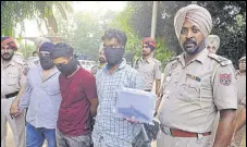  ?? HT PHOTO ?? The accused in police custody in Jalandhar on Thursday.