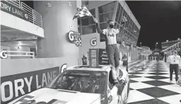  ??  ?? Denny Hamlin celebrates after winning a NASCAR Cup Series race Sunday in Homestead, Fla.