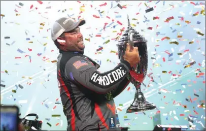  ?? The Sentinel-Record/Richard Rasmussen ?? INSTANT LEGEND: Clent Davis celebrates Sunday at Bank OZK Arena after winning the Fishing League Worldwide’s Forrest Wood Cup held on Lake Ouachita.