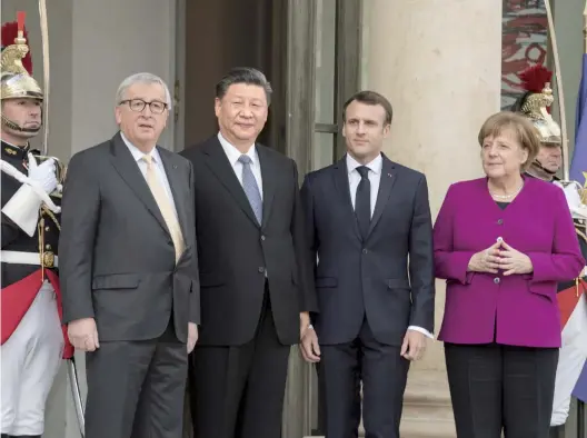  ??  ?? China actively engages in global governance. China shares the same standpoint with the majority of the participat­ing parties, which is conducive to stabilize the existing global governance system. The China-France Global Governance Forum was held in Paris in March, 2019. The picture shows Chinese President Xi Jinping meeting with French President Emmanuel Macron, German Chancellor Angela Merkel and European Commission President Jean-Claude Juncker who attended the closing ceremony on March 26th. (Photo source: Xinhua News Agency)