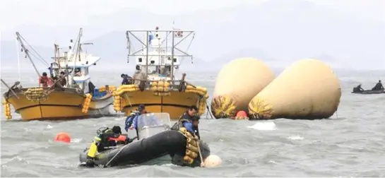  ??  ?? Teams of divers have been searching the sunken ferry for the bodies of those who died.