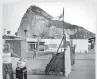  ??  ?? A tourist stands after leaving the British colony of Gibraltar at its border with Spain (Reuters).