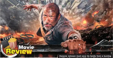  ??  ?? Dwayne Johnson must save his family from a burning building in Rawson Marshall Thurber’s ‘Die Hard’ wannabe.