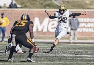  ?? Photos by Hunter Dyke / Mizzou Athletics via Getty Images ?? Sarah Fuller, a senior goalkeeper for Vanderbilt’s SEC championsh­ip soccer team, broke a gender barrier in football Saturday, kicking off for the Commodores to begin the second half of their game against Missouri. She became the first woman to play in a game involving a school in a Power 5 conference.