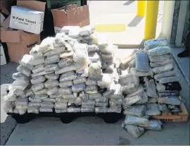  ?? U.S. Department of Justice ?? AUTHORITIE­S in Mexico, Colombia and L.A. seized 7,700 pounds of cocaine and other drugs in the four-year investigat­ion, including these packages in May 2015.