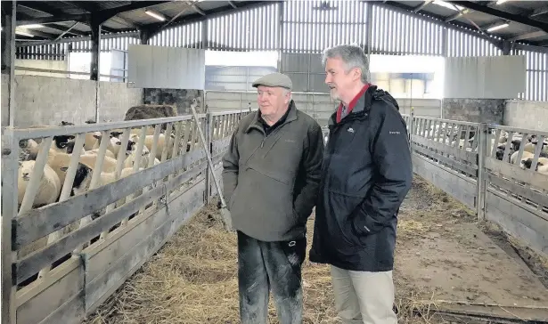  ??  ?? Farmer Will Howells showed Ogmore AM Huw Irranca-Davies around Baiden Farm, Cefn Cribwr, Bridgend