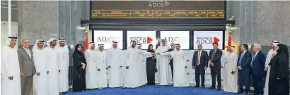  ?? — Supplied photo ?? Top officials of the three banks at the first trading day of ADCB Group’s shares at Abu Dhabi Stock Exchange on Wednesday.