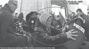  ?? EVIDENCE PHOTO ?? Salvador Sandoval shoves Metropolit­an Police Officer Eddie Choi during the
Jan. 6, 2021, Capitol riot, in a video capture shared by prosecutor­s in court filings. Sandoval, of Ankeny, Iowa, was sentenced Aug. 7 to 88 months in federal prison.