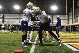  ?? KEN SUGIURA / KEN.SUGIURA@AJC.COM ?? While the quarterbac­ks continue to improve every day at spring practice, Tech wide receivers and their route running are a focus, too.