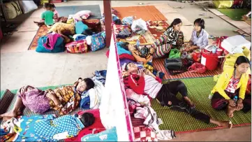  ??  ?? Internally displace people resting in a church compound in Myitkyina after  eeing con ict between government troops and ethnic armed group in Kachin state.