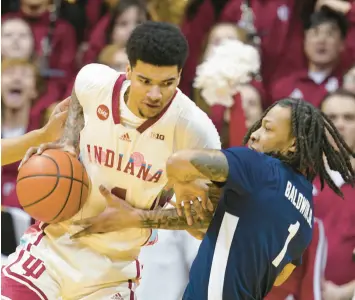  ?? DARRON CUMMINGS/AP ?? Indiana’s Kel’el Ware goes to the basket against Penn State’s Ace Baldwin Jr. during the first half on Saturday.