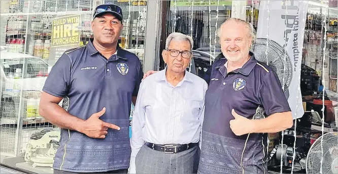  ?? Picture: SUPPLIED ?? The late Vinod Patel is flanked by Ba Rugby officials Vilimoni Delasau (left) and Jeremy Duxbury outside the Vinod Patel shop in Ba.