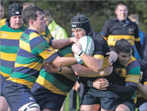  ??  ?? Lochaber’s Angus Jenkins under attack from all sides. Photograph­s: Iain Ferguson, alba.photos