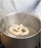  ??  ?? 4. Boil the pretzels in water with baking soda to set their shape, help them brown, and make them chewy.