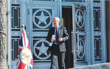 ?? AFP ?? British ambassador to Russia Laurie Bristow leaves the Russian Foreign Ministry in Moscow on Friday.