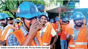  ??  ?? Indian workers at a local site. Pic by Amila Gamage