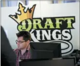  ?? AP PHOTO/CHARLES KRUPA ?? In this Thursday, Jan. 11, 2018, file photo, employees work at the DraftKings office in Boston.