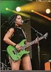  ?? CONTRIBUTE­D BY COURTNEY GURLIE ?? The Txlips’ lead guitarist, Gabriella Logan, rocks the stage at the Afropunk Festival.